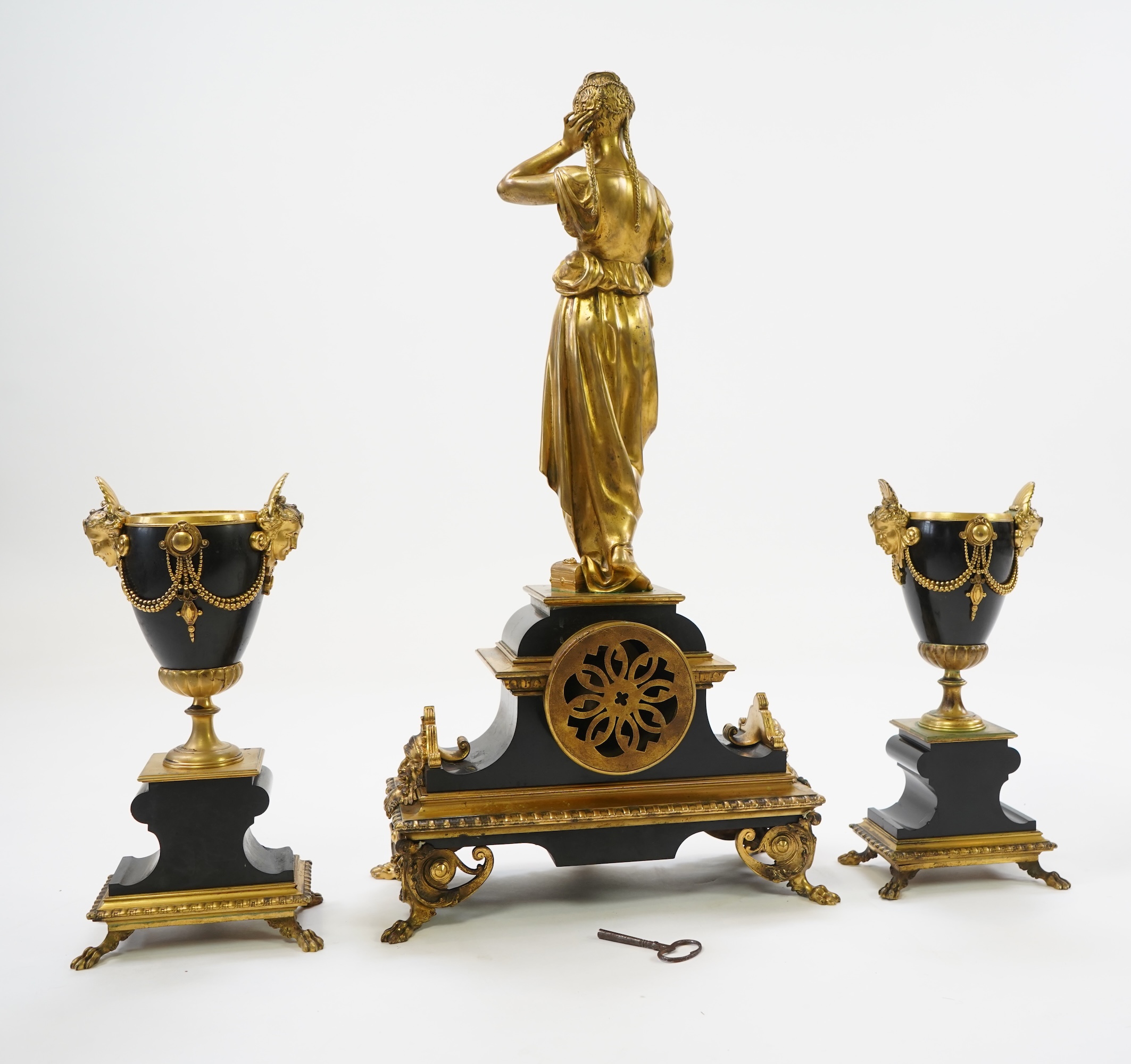 A French gilt bronze figural clock garniture, late 19th century